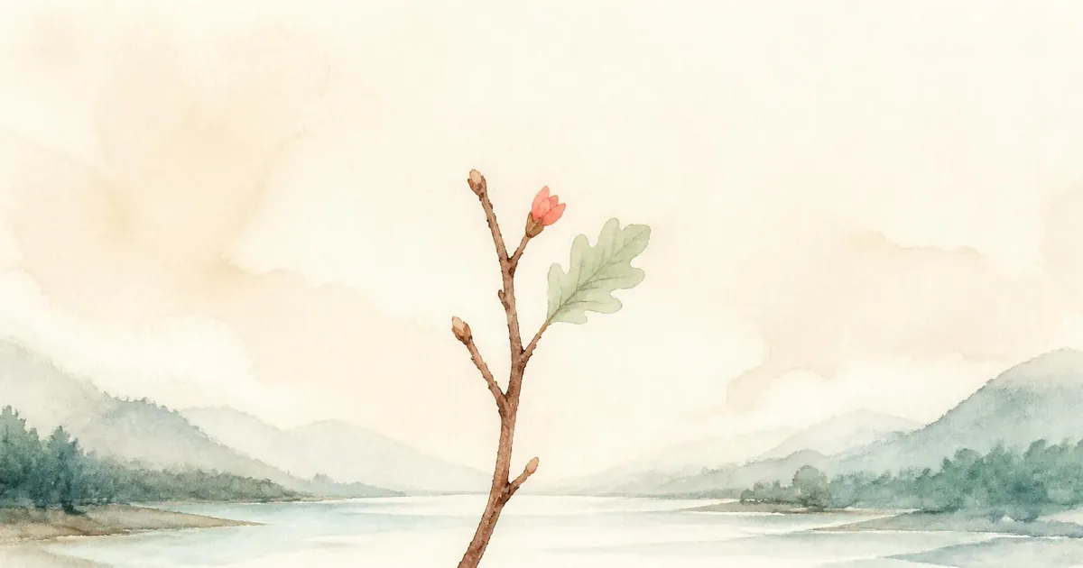 A bare brown twig with one new sage oak leaf and a small coral bud above a calm pale river and soft hills.